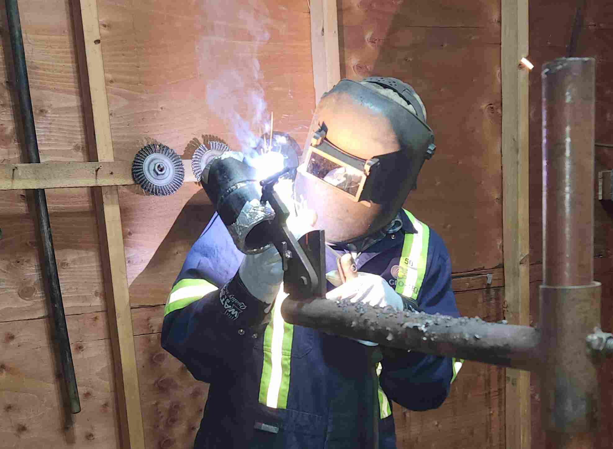 A worker doing a pressure welding test